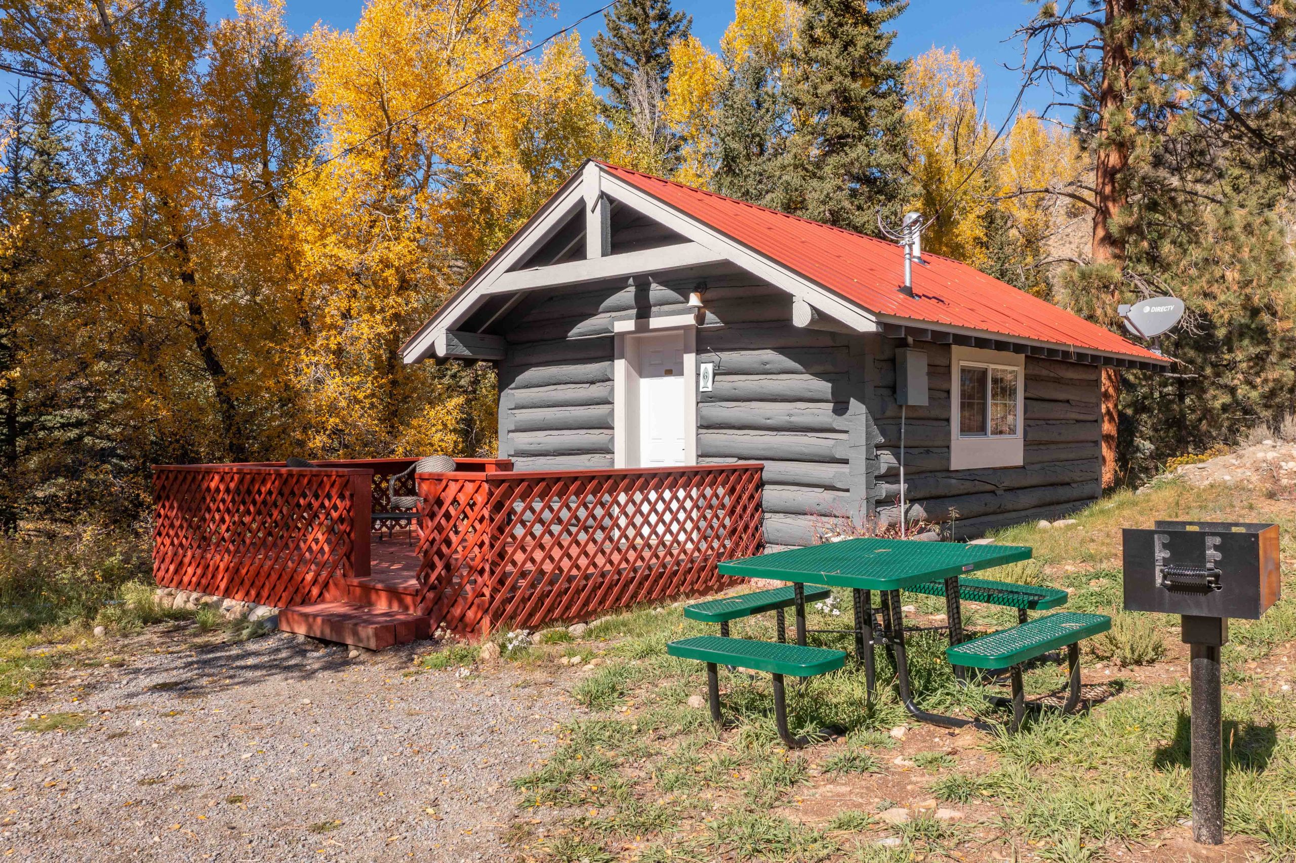 Cabin 6 Exterior Red Picnic Tables
