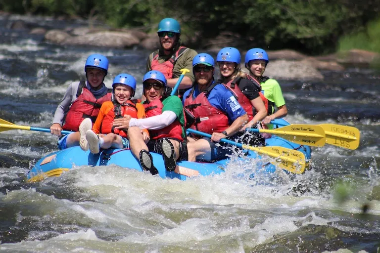 Family whitewater rafting big waves