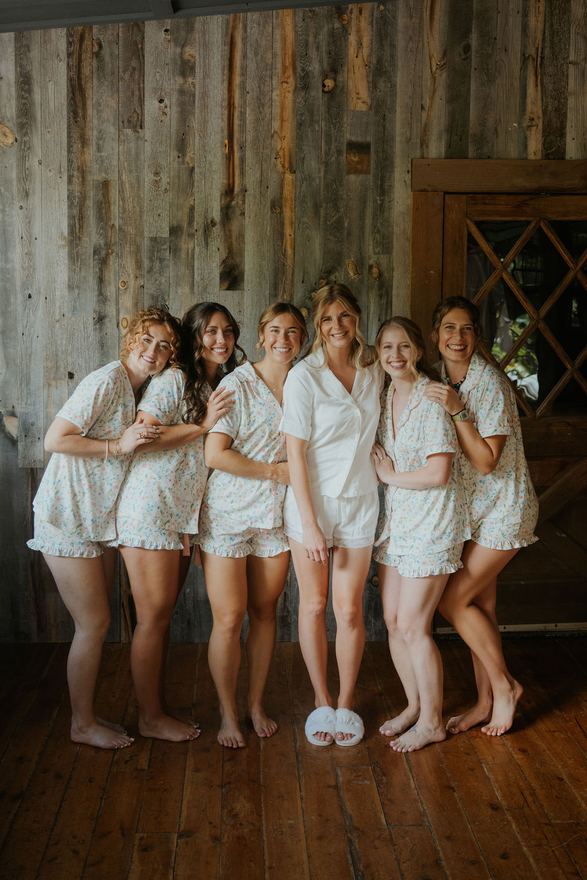 Bride and bridesmaids getting ready in a cabin