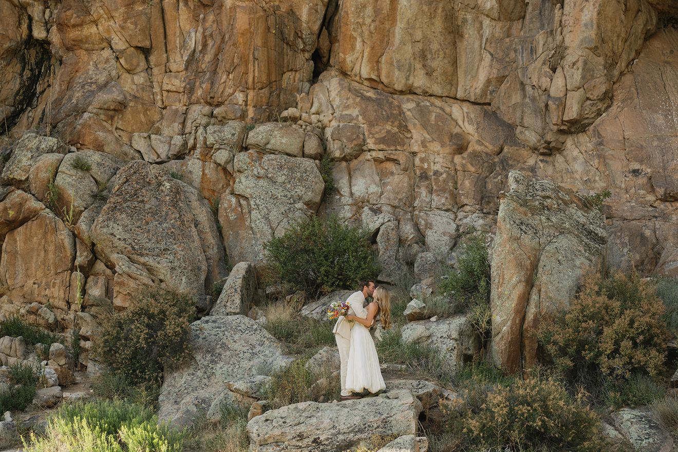 Bride and groom among granite rocks