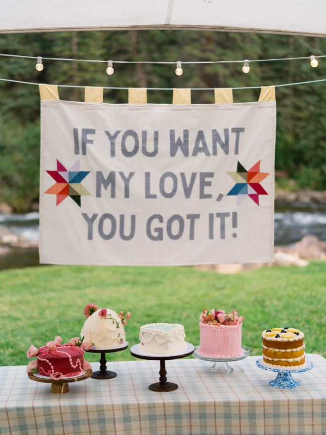 Dessert table with five wedding cakes