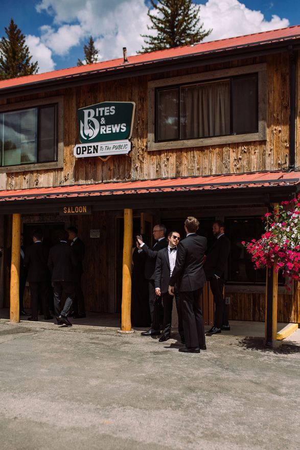 Groomsmen outside the Bites & Brews saloon