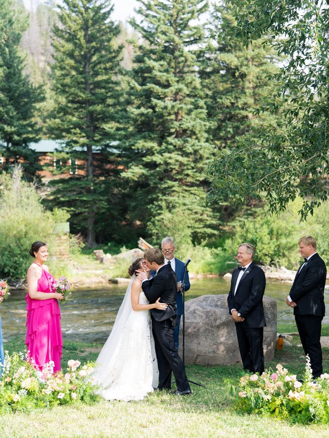 Wedding ceremony at the altar beside the Taylor River