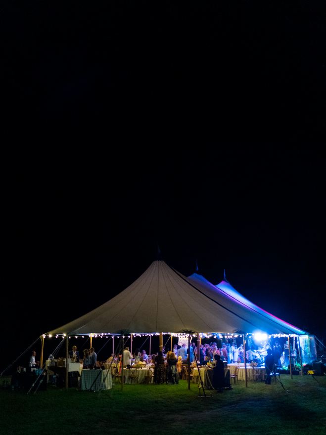 Sailcloth tent reception lit up at night
