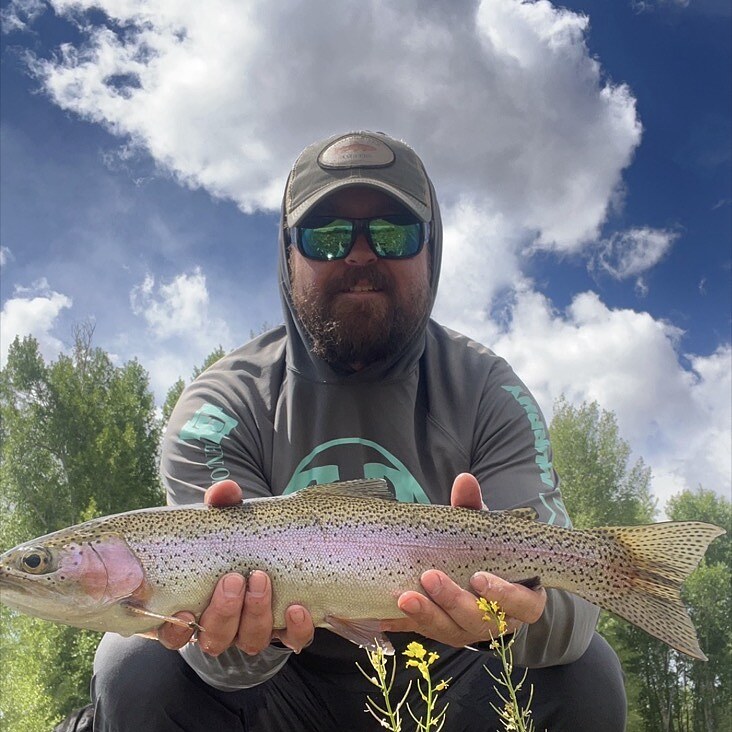 John Evon holding a Taylor River rainbow trout
